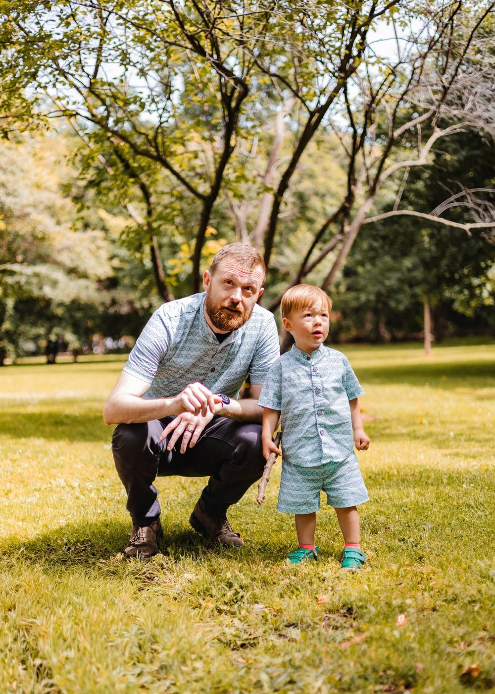 Adam Overberg outdoors with his son